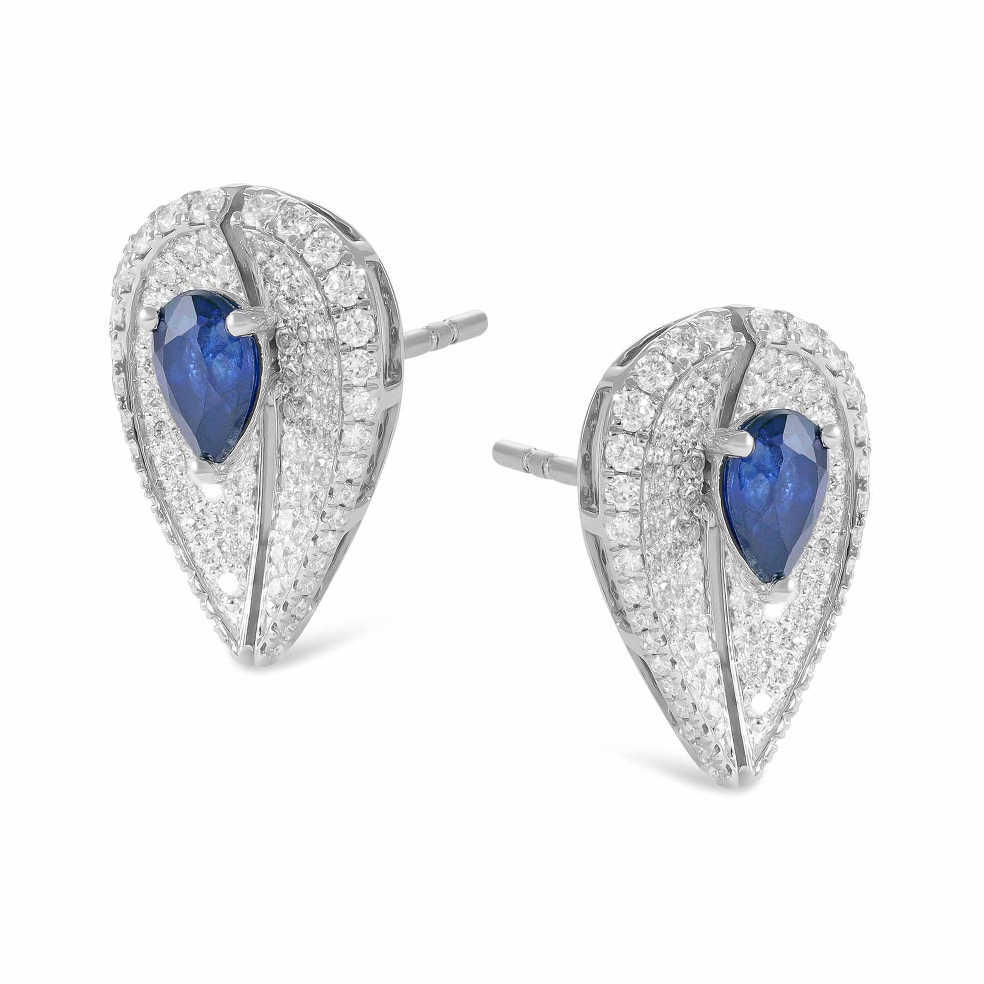18ct White Gold Diamond And Saphire Halo Earrings - angled view. Elegant nan adorned with gems of remarkable colour and brilliance. Discover affordable luxury today.